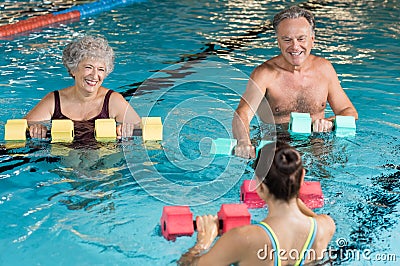 Seniors doing aqua aerobics Stock Photo