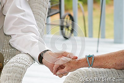 Seniors holding hands Stock Photo