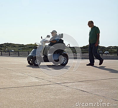 Seniors. Independence with disability. Mobility scooters. Editorial Stock Photo