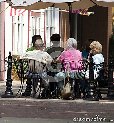 Seniors at outdoor cafe Stock Photo