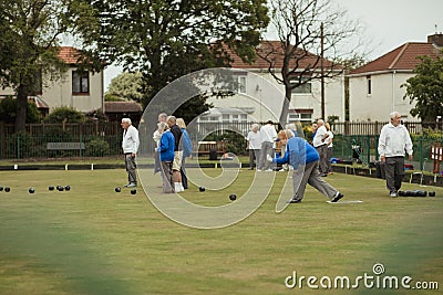 Seniors Playing Lawn Bowling Stock Photo