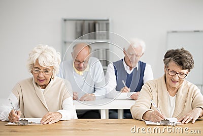 Seniors writing test Stock Photo