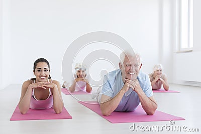 Seniors and yoga instructor Stock Photo