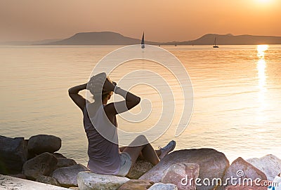 Sensational sunset delight woman at Balaton lake Stock Photo