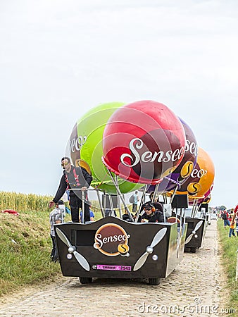 Senseo Caravan on a Cobblestone Road- Tour de France 2015 Editorial Stock Photo