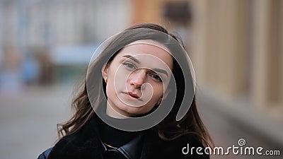Sensitive portrait of a brunette girl on a cloudy spring day Stock Photo