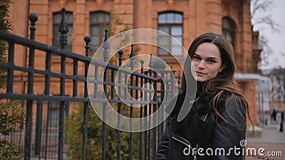 Sensitive portrait of a brunette girl on a cloudy spring day Stock Photo