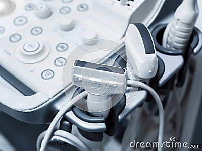 Sensors of ultrasound machine with buttons. Modern medical equipment in white gray. Detail Stock Photo