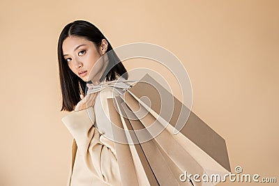 sensual asian woman in ivory blazer Stock Photo
