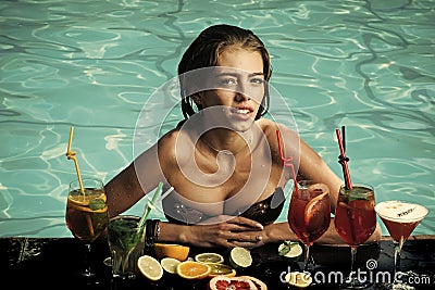 Sensual woman. Woman with alcoholic beverage and fruit. Stock Photo