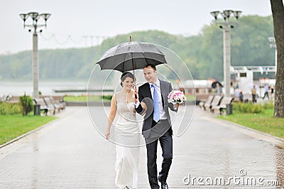 Sensual wedding couple, groom and bride laughing and walking tog Stock Photo