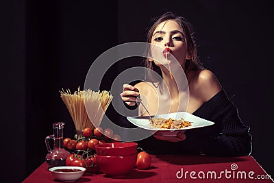 Sensual woman eat spaghetti. Italian girl eats spaghetti pasta. Stock Photo
