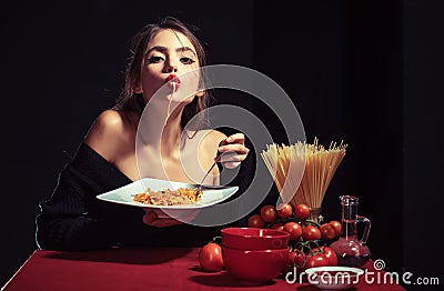 Sensual woman eat spaghetti. Italian girl eats spaghetti pasta. Stock Photo
