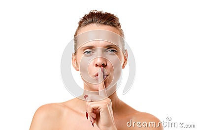 Sensual young woman making a hush gesture Stock Photo