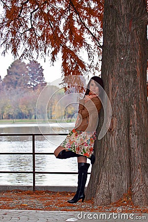 Sensual young woman waiting in park Stock Photo