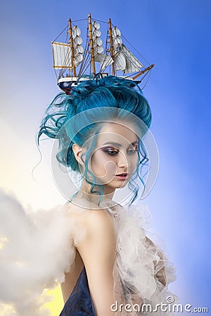 Sensual young girl with naked shoulders and painted blue hair st Stock Photo