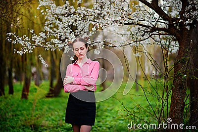 Sensuality. Happy beautiful young woman relaxing in blossom park Stock Photo