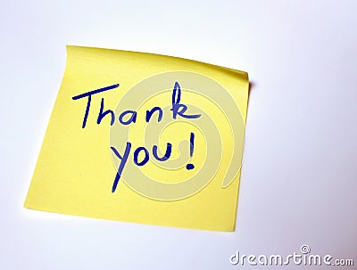 The sentence Thank you written by hand on a yellow post it Stock Photo