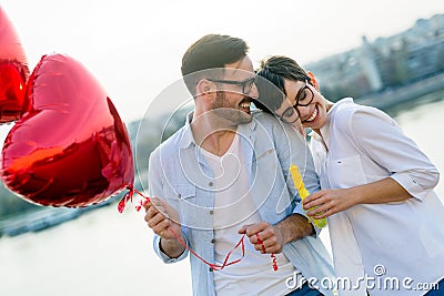 Sentimental young and smiling couple in love bonding Stock Photo