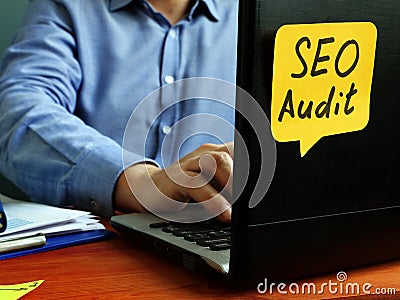 SEO audit concept. Specialist working with laptop Stock Photo