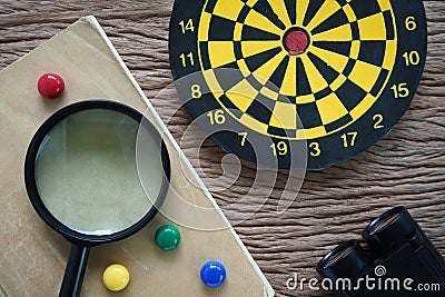 SEO optimization concept with, dartboard, binoculars and magnify Stock Photo