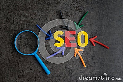 SEO, Search Engine Optimization ranking concept, magnifying glass with arrows pointing to alphabets abbreviation Stock Photo