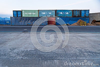 Coloured containers with the letters Wan Hai on the harbour of Seogwipo, Jeju Island, South Korea Editorial Stock Photo