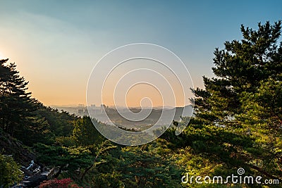 Seoul city building at sunset from Yongamsa Temple in Bukhansan National Park, Seoul, South Korea Stock Photo