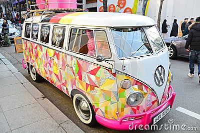 Seoul, Korea - March 7, 2015 : vintage white Volkswagen camper bus decorate with colorful sticker parked on street Editorial Stock Photo