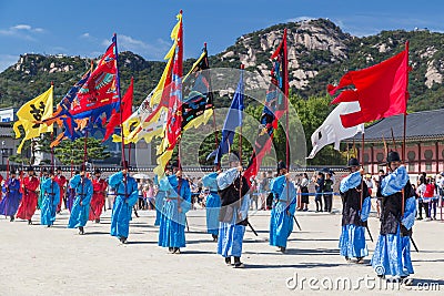 Seoul, South Korea - circa September 2015: Palace guards marching in traditional Korean dresses in Gyeongbokgung Palace, Seoul, K Editorial Stock Photo