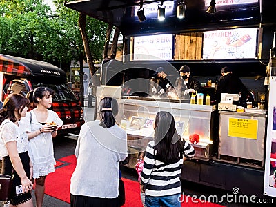 Seoul, South Korea - June 3, 2017: People queuing up at the fast food kiosk at the street near Cheonggyecheon stream in Seoul Editorial Stock Photo