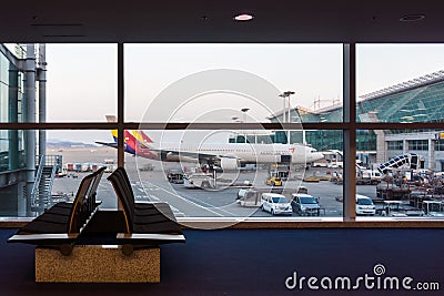 Asiana plane viewed from concourse of the airport Editorial Stock Photo