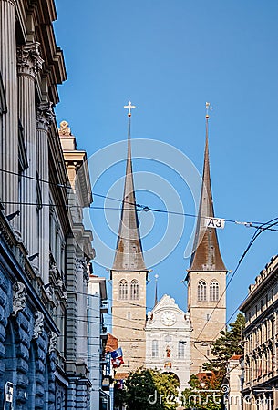 Old vintage bell tower steeple of Hofkirche St. Leodegar Lucerne, Swizerland Editorial Stock Photo