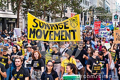 Sep 20, 2019 San Francisco / CA / USA - Sunrise Movement an American youth-led political movement members carrying placards and Editorial Stock Photo