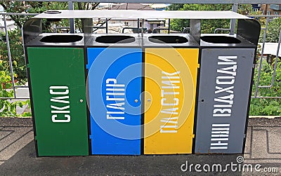 Separate trash cans for sorting waste. Environmental situation and waste collection by components Editorial Stock Photo