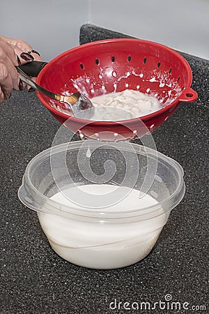 Separating Milk Kefir And Grains Stock Photo