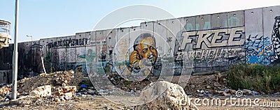 Separation wall with murals and guard house Editorial Stock Photo