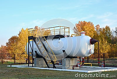 Separator at oilfield production facility, separating oil and gas from the well streams. Crude oil metering station and pipeline Stock Photo