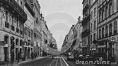Sepia image of Bordeaux tram lines with cycle passing in the center. Editorial Stock Photo