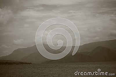 Sepia Tone Toba Lake and Mountain View from Pangururan in Samosir Island, Indonesia Stock Photo