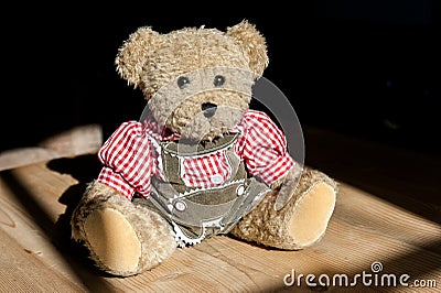 Sepp from Bavaria, a Teddybear as part of a collection, wearing traditional clothing, like a checkered shirt and leather pants Stock Photo