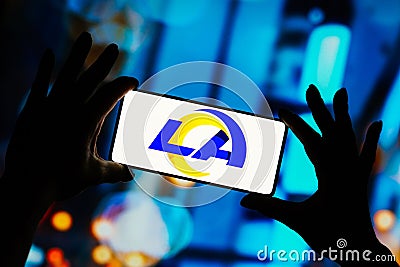 September 9, 2023, Brazil. Los Angeles Rams logo is displayed on a smartphone screen. It is a Cartoon Illustration