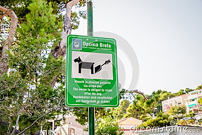 September 29, 2020. Brela, Croatia, Europe. Sign for dog owners. The owner is obliged to clean up after dog sign Editorial Stock Photo