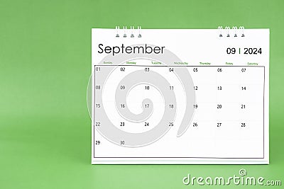 September 2024 desk calendar isolated in green background Stock Photo