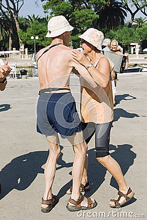 September 22, 2011, music and dance competition in Croatia, Hvar island. Elderly people dance and enjoy life outside on the water Editorial Stock Photo