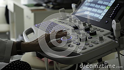 Serbia, Belgrade - September 13, 2023: The female doctor hand conducts a medical examination, using an ultrasound Editorial Stock Photo