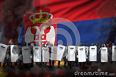 Serbia police guards in heavy smoke and fire protecting government against mutiny - protest stopping concept, military 3D Stock Photo