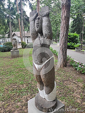 Serbia Sokobanja wooden statue of a woman in the park Stock Photo