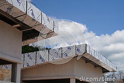 Aluminum sheet cladding installation work is in progress. Editorial Stock Photo