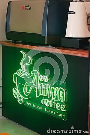 Neon Coffee sign a the shop. Aiwa coffee, fresh adenosine blocker daily Editorial Stock Photo